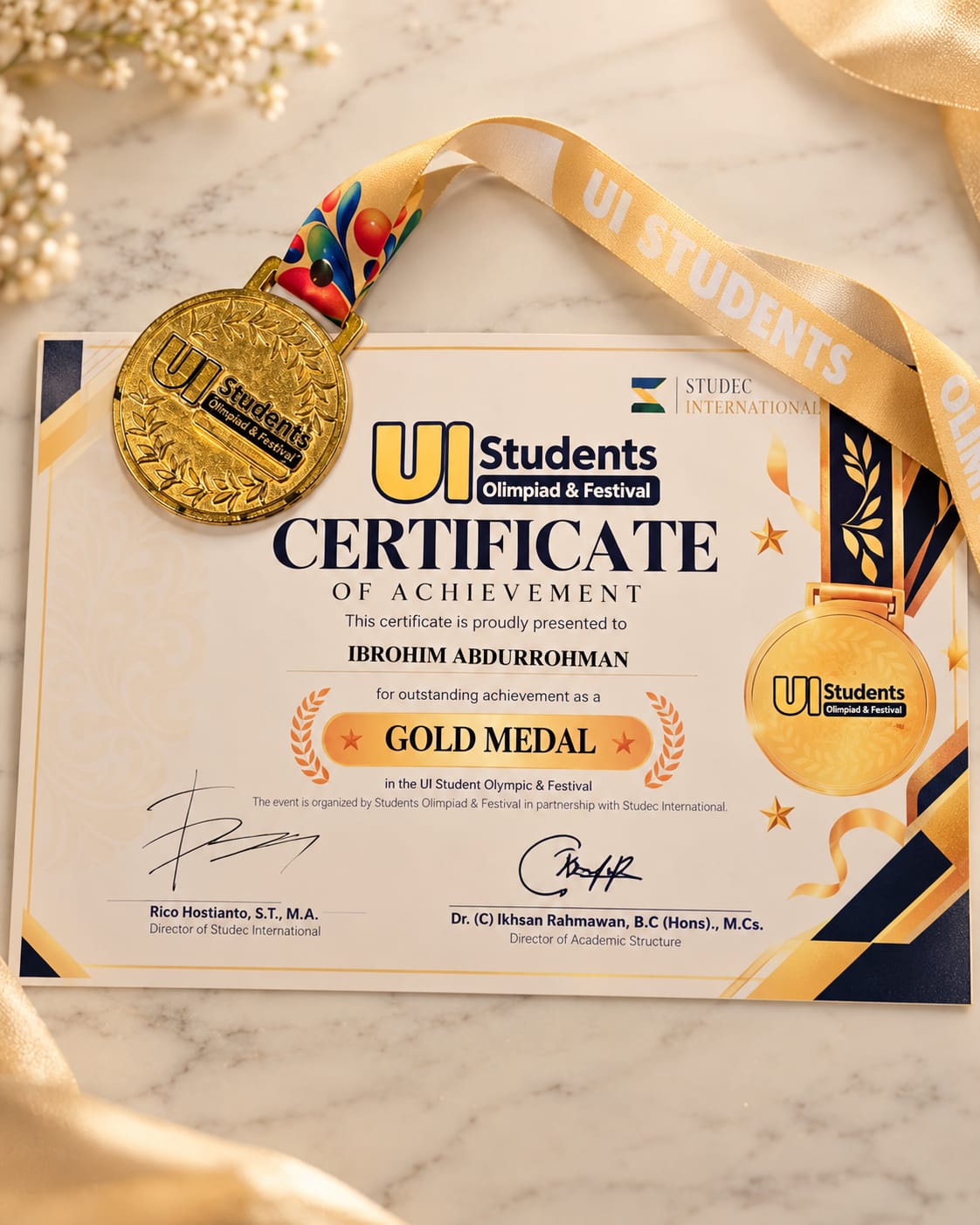 Sertifikat dan medali Gold Medal Ibrohim Abdurrohman pada UI Students Olympiad & Festival 2026
